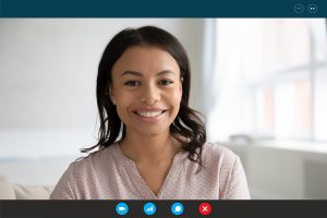 Therapist smiling over video chat