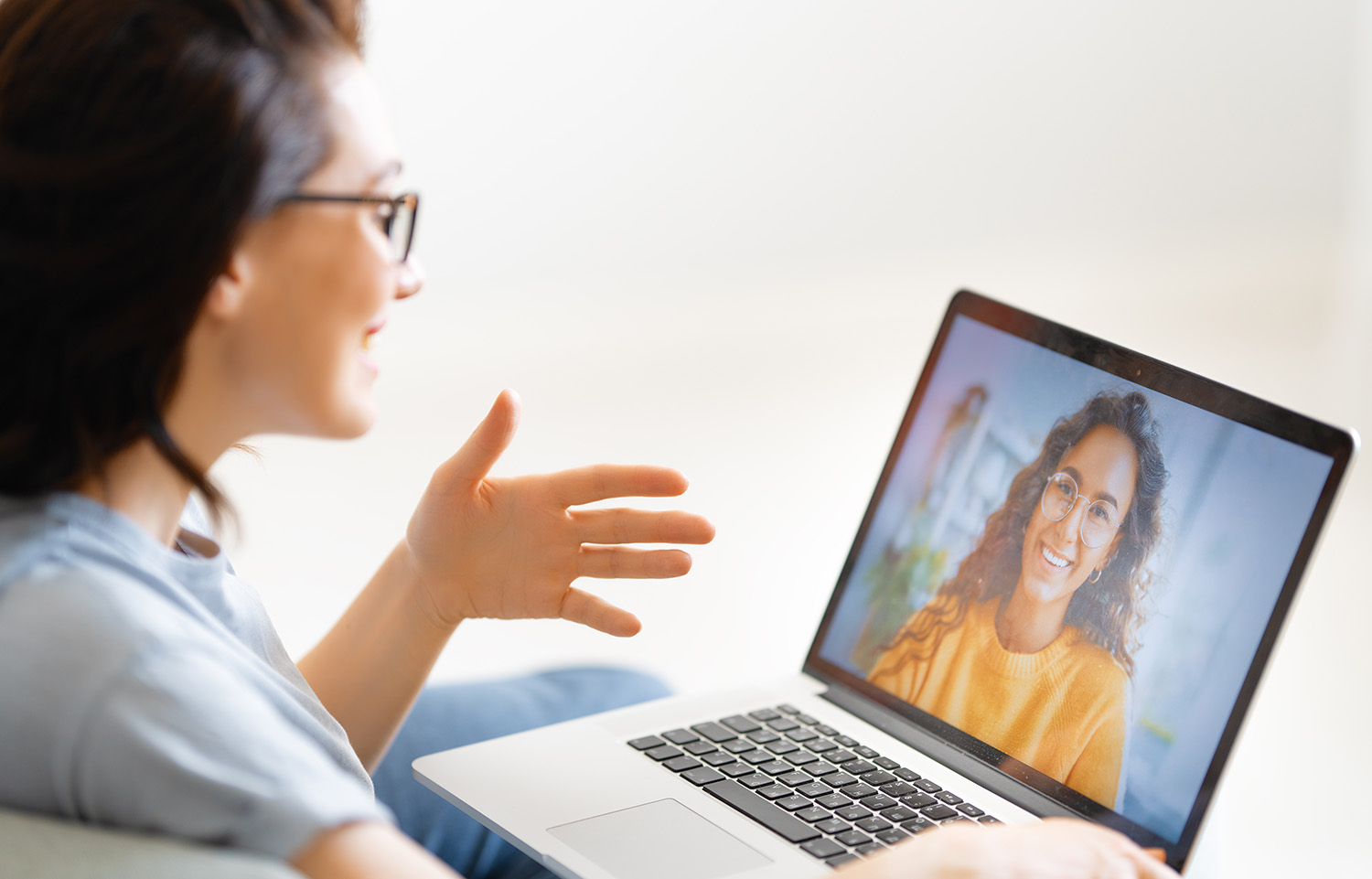 Parent talking about concern with therapist over video chat