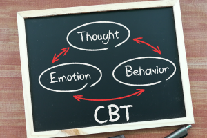 Chalkboard representing cbt and how cbt and dbt differ from each other.
