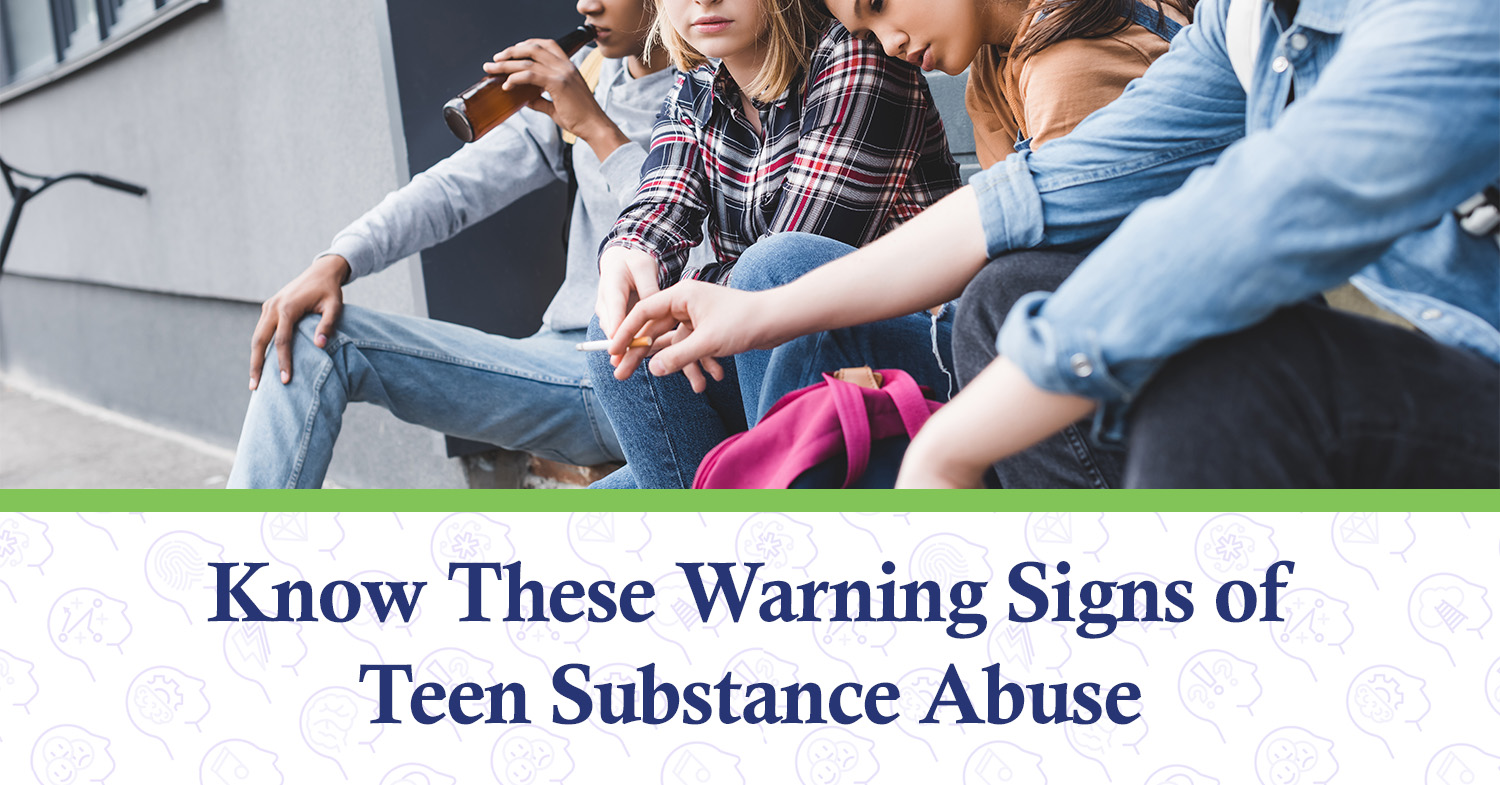 Teens sitting outside, taking part in substance abuse.